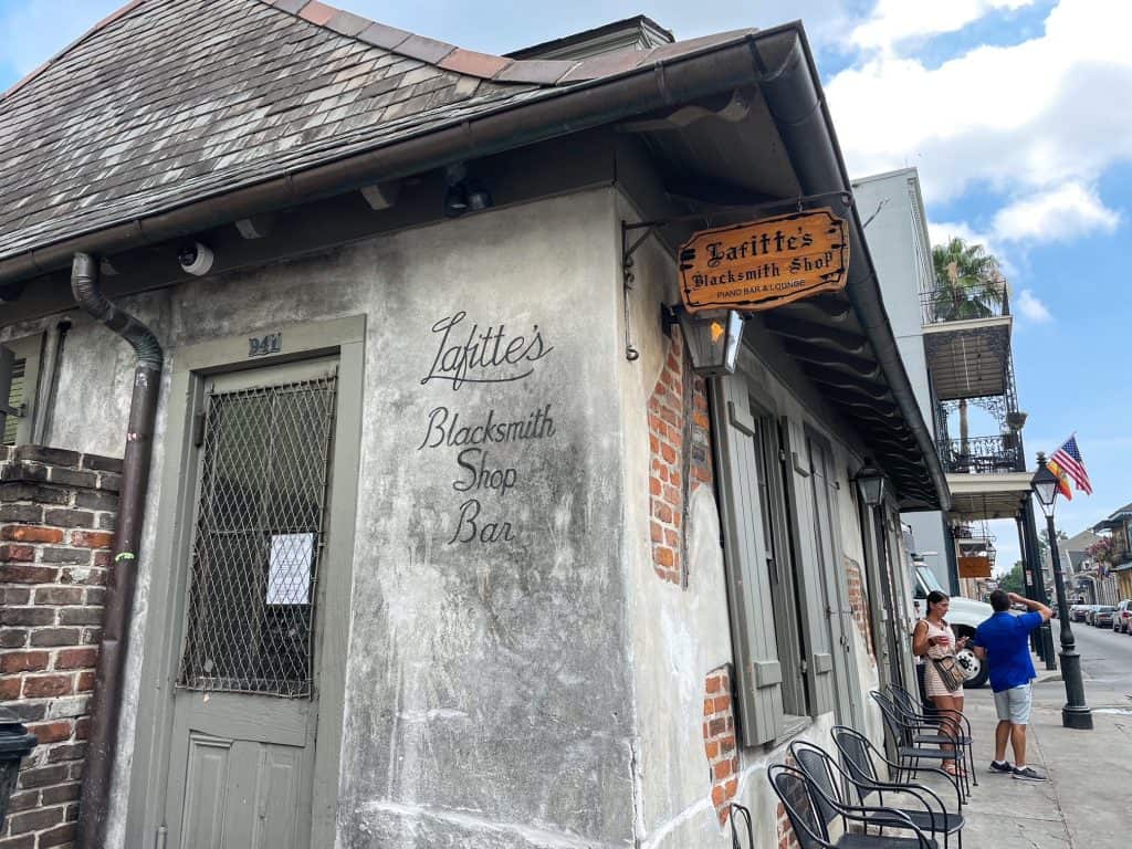 A close-up view of Lafitte's Blacksmith Bar that looks super old and being transported back in time.