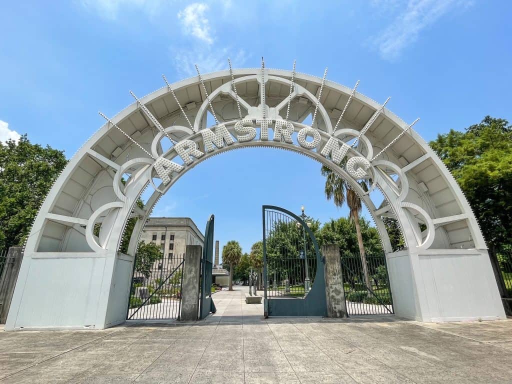 The arched entryway in Louis Armstrong Park that says "Armstrong".