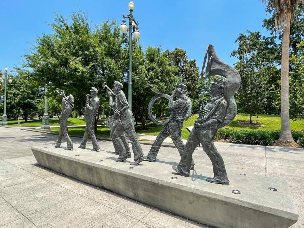 A series of statues in Louis Armstrong Park that are playing instruments for jazz music.