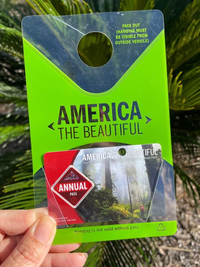 An America The Beautiful Pass in a hanging placard.