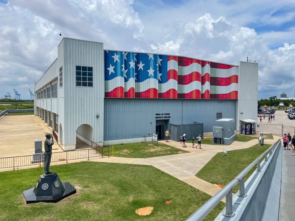 A huge American flag painted on the outside of the hanger at the USS Alabama Memorial Park is one of the top Mobile attractions.
