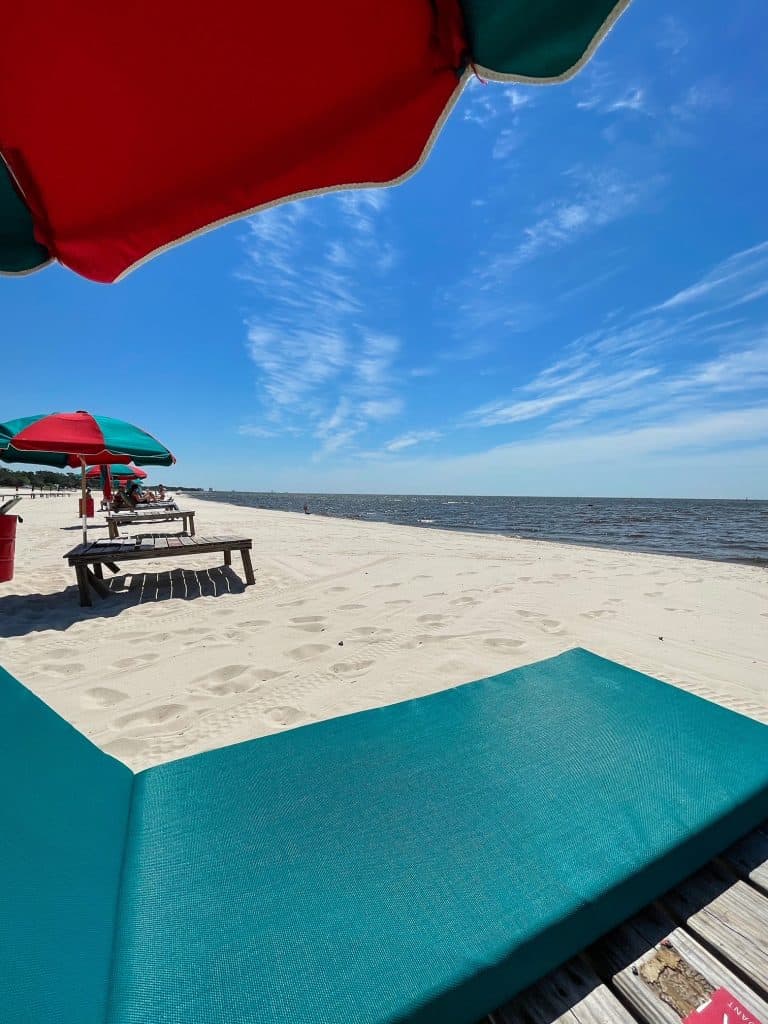 Sitting on a beach lounger chair enjoying the views of the beach and water of the Gulf of Mexico.