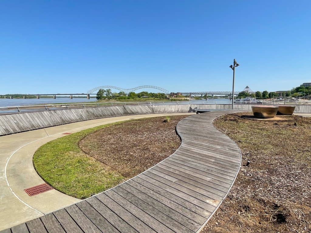 Walking along a boardwalk at Beale Street Landing with beautiful views of the Mississippi River in Memphis.