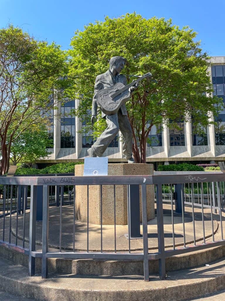 A statue of Elvis Presley with his guitar on Beale Street in Memphis, TN.