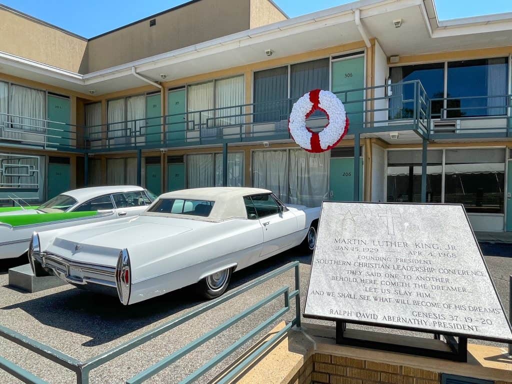 Two old cars from the 1960s parked out front of the room where Martin Luther King Jr was shot at the Lorraine Motel in Memphis, TN.