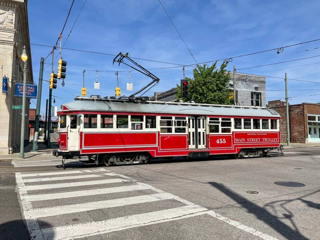 A vintage red and white street trolley that runs up and down Main Street in downtown Memphis.