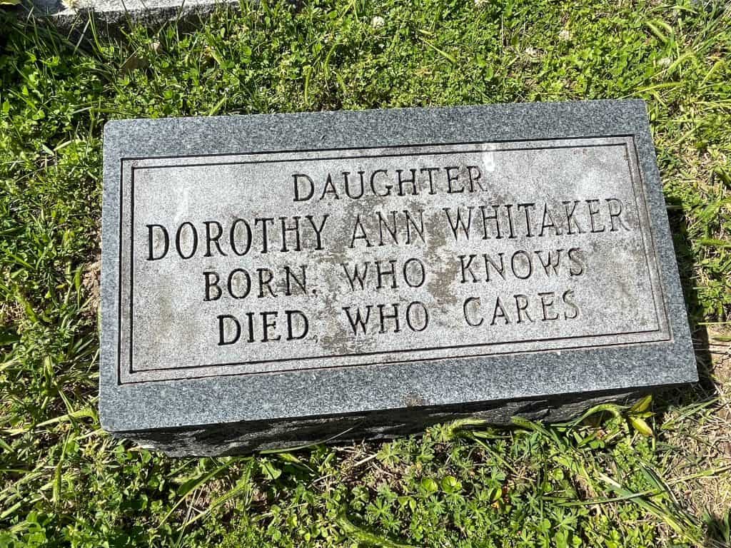 A funny quote on a headstone that says "born who knows, died who cares" at Elmwood Cemetery.