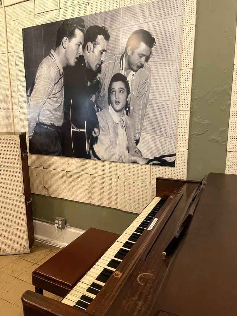 A photo above a piano with Elvis Presley, Johnny Cash, Jerry Lee Lewis, and Carl Perkins at Sun Studio in Memphis, TN.