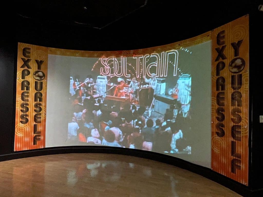 A small dance floor with video of Soul Train and music playing at the STAX Museum in Memphis, TN.