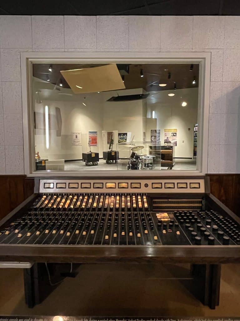 The control panel for recording music looking into the sound room where artists would be singing at STAX.