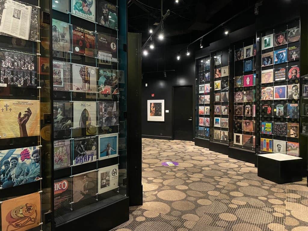 Walking through room floor to ceiling with records that were recorded at STAX in Memphis, Tennessee.