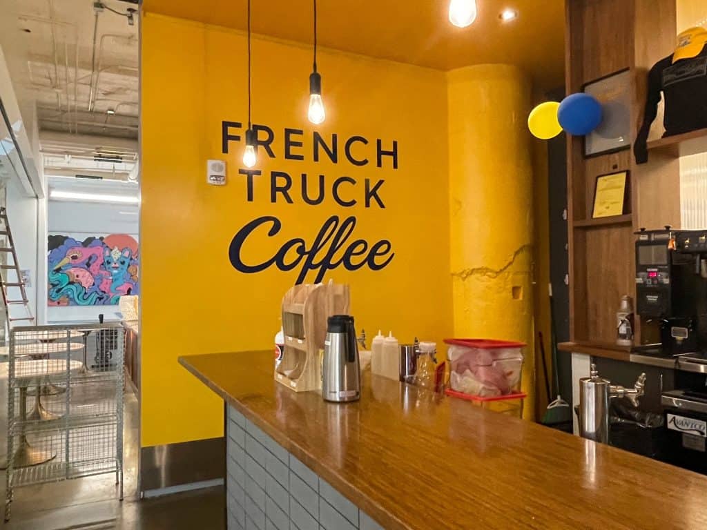 The bright yellow French Truck Coffee shop in Crosstown Concourse in Memphis.