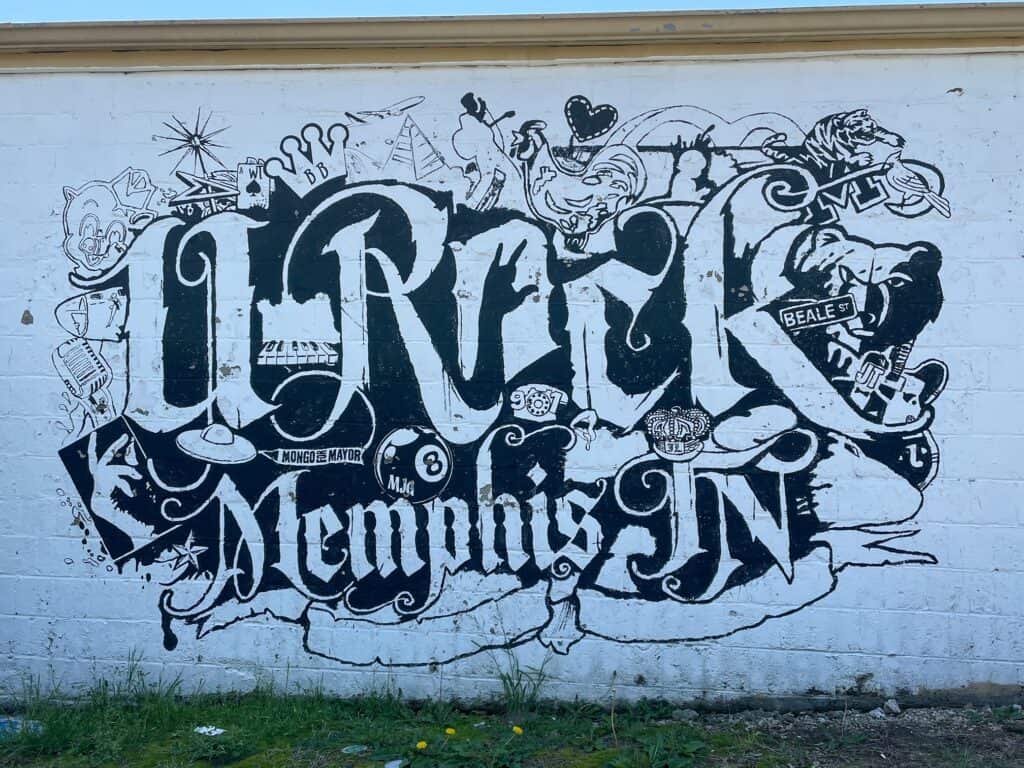 An art mural with the words "U Rock, Memphis TN" near one of the best Memphis BBQ restaurants.