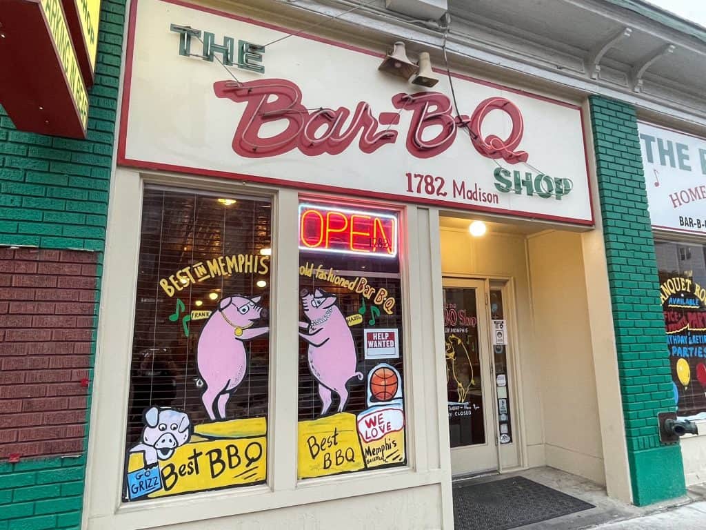Front of the Bar-B-Q Shop with dancing pigs painted of the windows and home of the BBQ spaghetti in Memphis.
