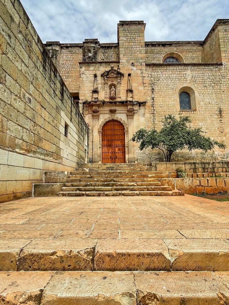 Steps leading up to a side door at the beautiful Templo de Santo Domingo that used to be a convent.
