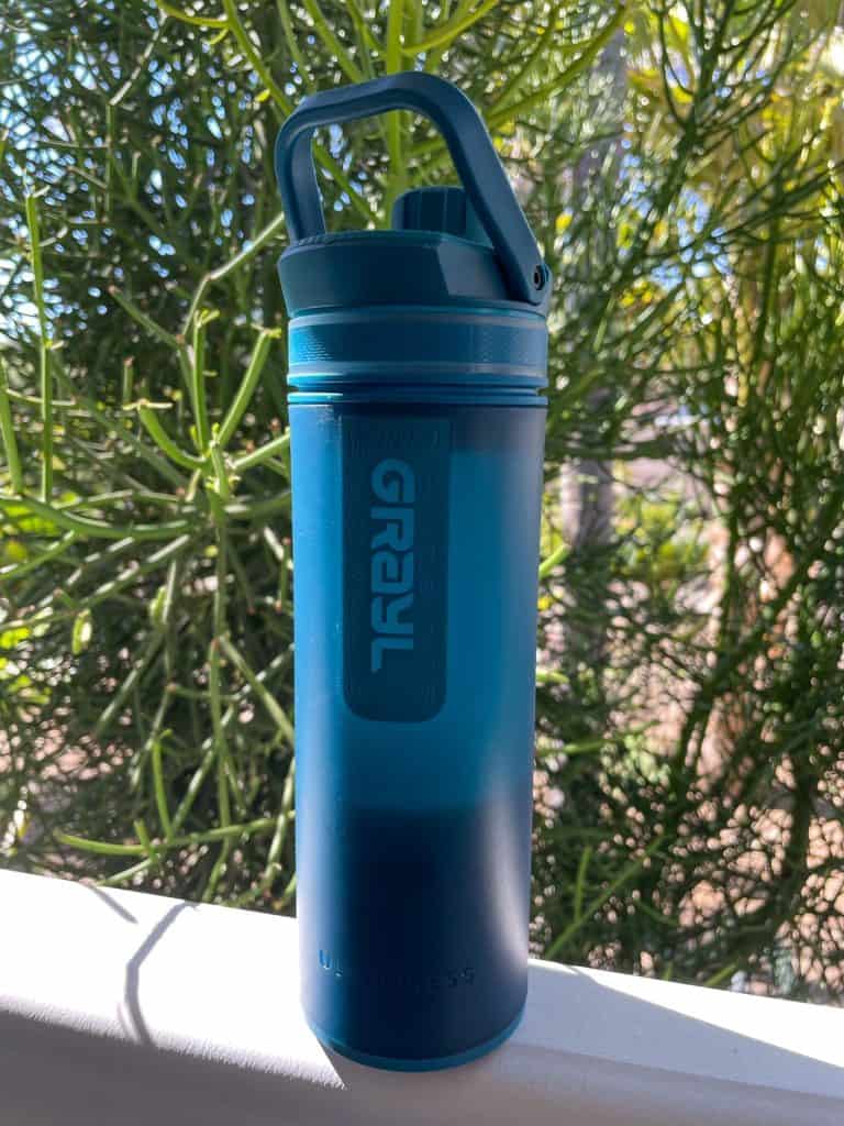 Grayl UltraPress filtered water bottle in a teal blue color