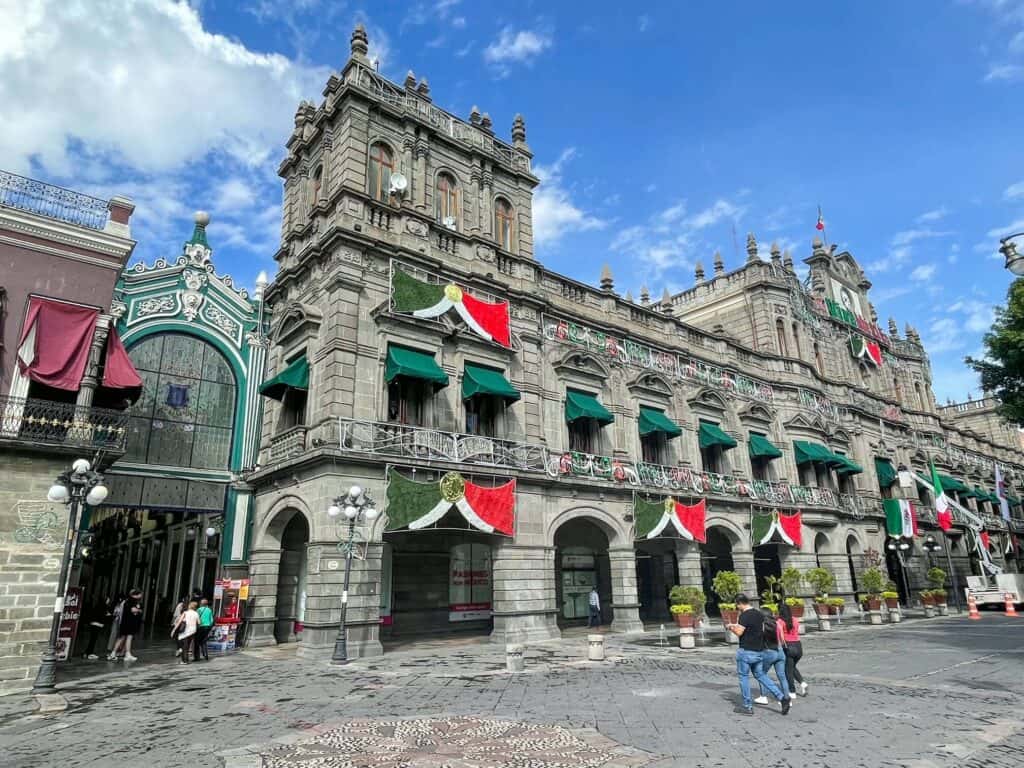 A beautiful and historic building with an attached arcade along the edge of the Zocalo.