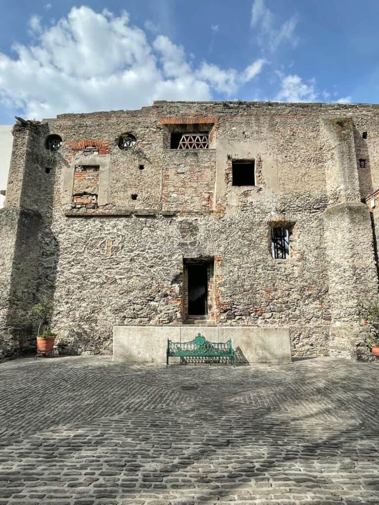 The front view with door of the old ruins behind Hotel La Purificadora in Puebla City.