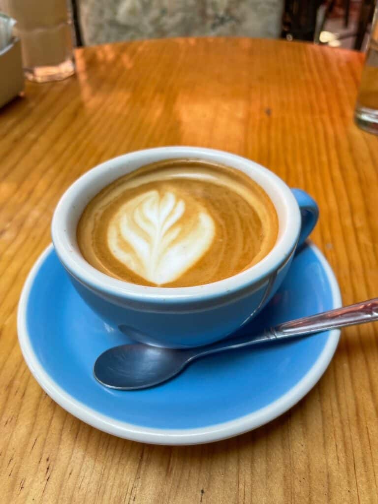 A tasty latte in a pale blue mug with a white trim at La Sacristia Cafe in San Miguel de Allende.