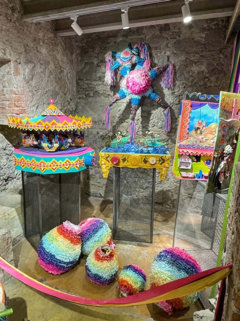 Rainbow colored sombrero, pinata, decorations and more at the Toy Museum.