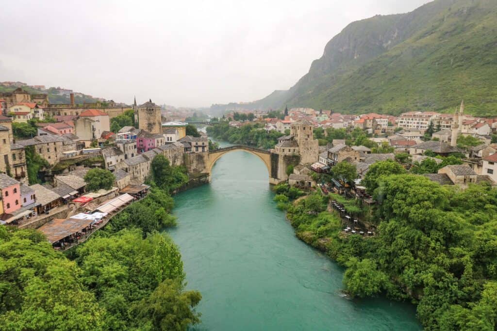 View of the lovely Stari Most or Old Bridge, river, and old town of Mostar, Bosnia from the top of the mosque tower.