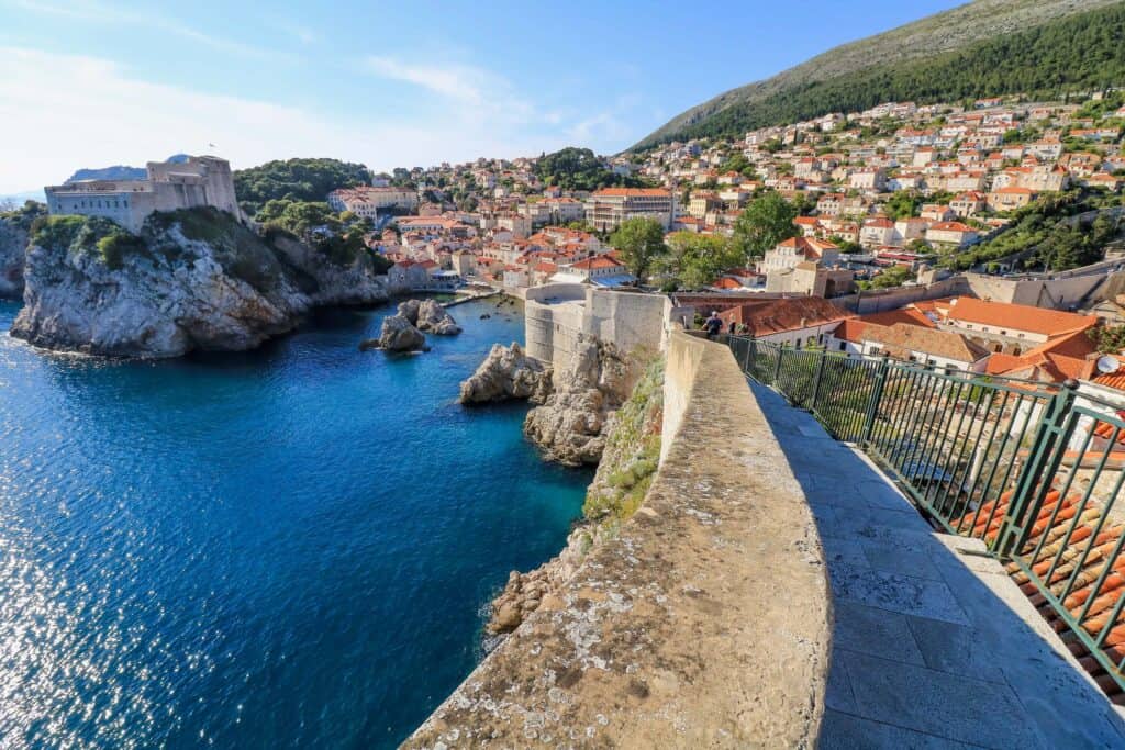 Standing on the Dubrovnik city walls looking back towards the city, small bay, and Mount Srd.