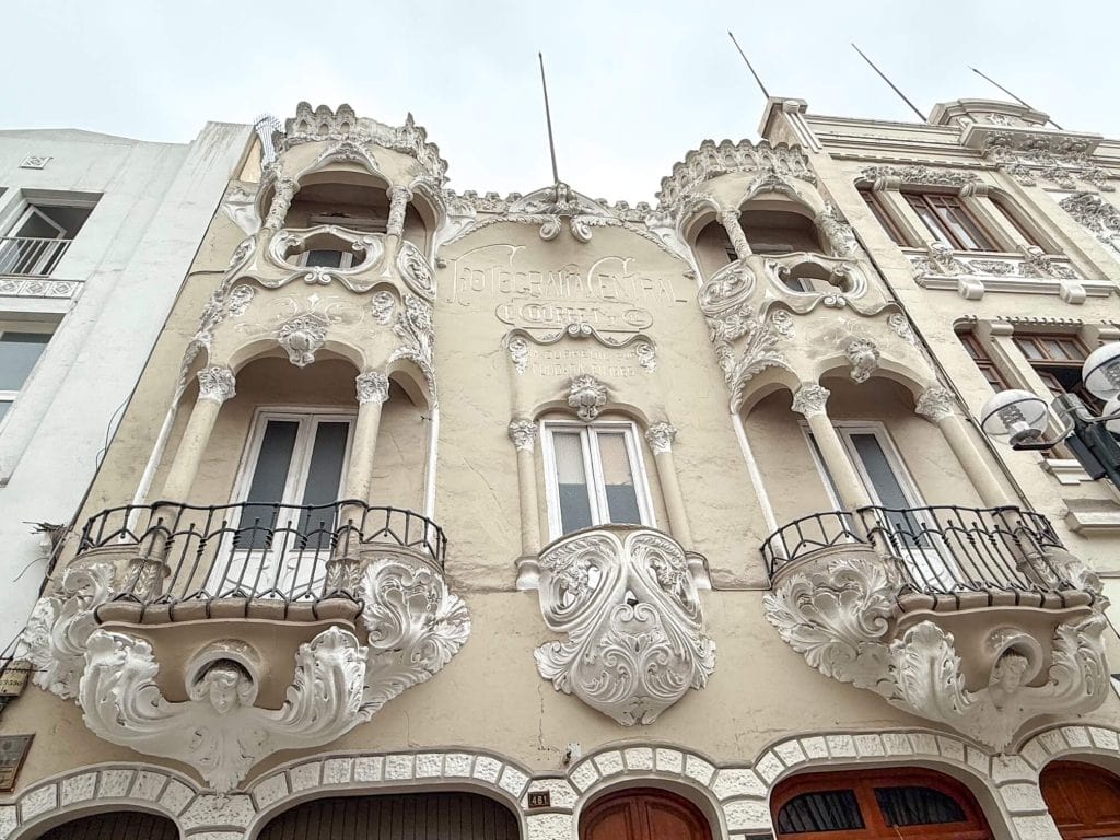 The art deco architecture of the Fotografia Central building with its tan color and white trim along Jiron de la Union in Lima, Peru.