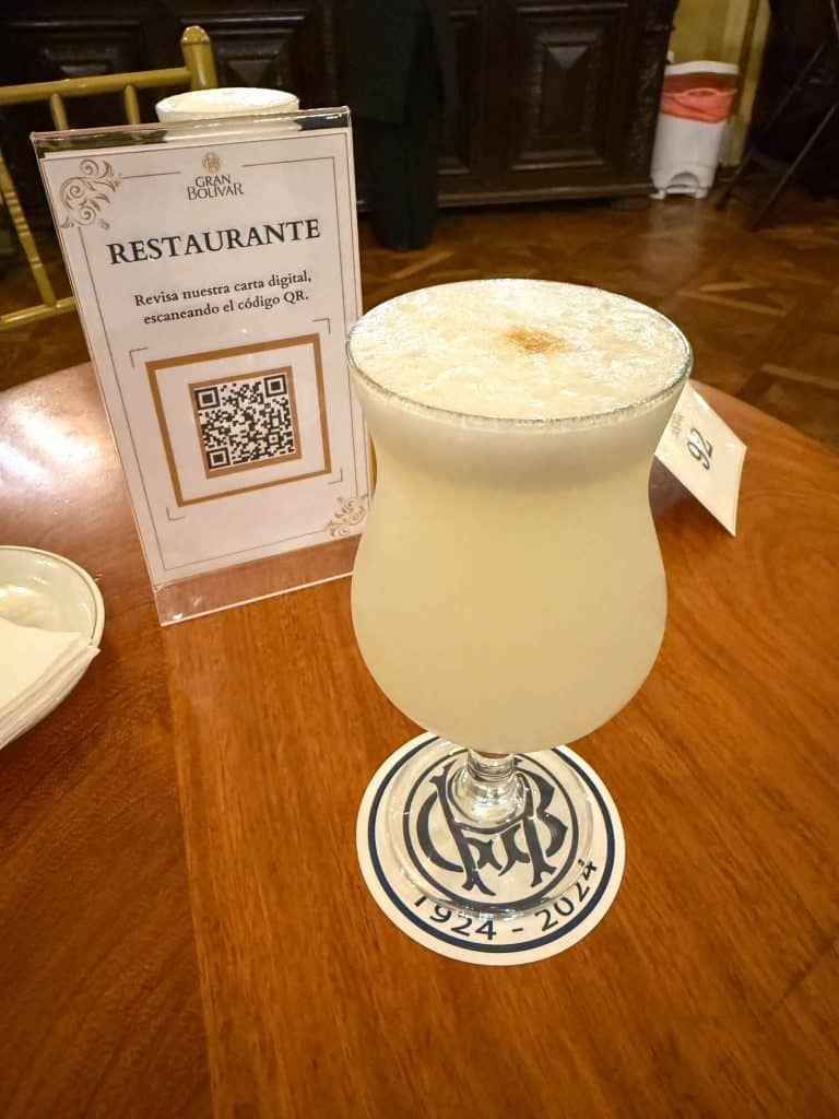 A double Pisco Sour cocktail at the iconic Gran Hotel Bolivar in Lima's historic district.