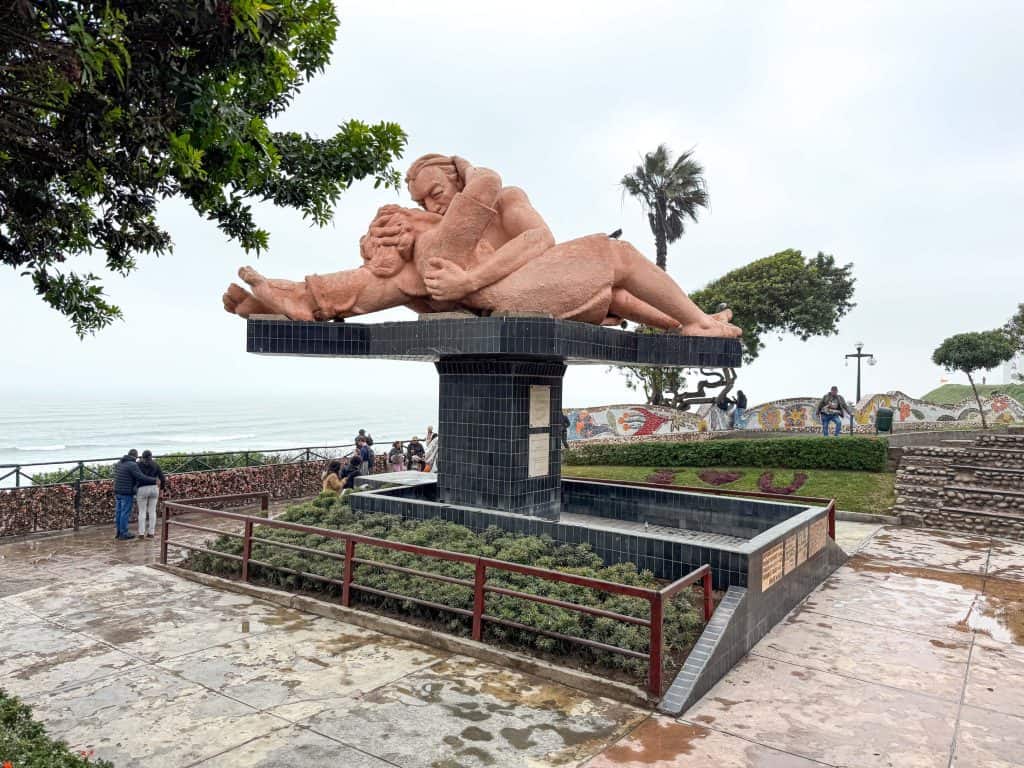 A huge statue of two lovers kissing in an embrace along the cliffs overlooking the Pacific Ocean at Lovers Park in Lima's Miraflores neighborhood.