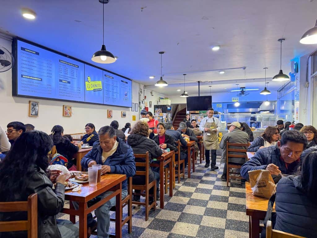 View of the small open eating area of Sanguchería El Chinito in Lima's historic district that has the best pork sandwiches.