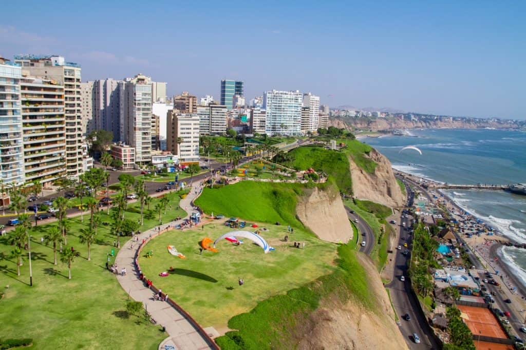 Aerial view of the coastal boardwalk and buildings n Miraflores, one of the best neighborhoods when wondering where to stay in Lima, Peru.
