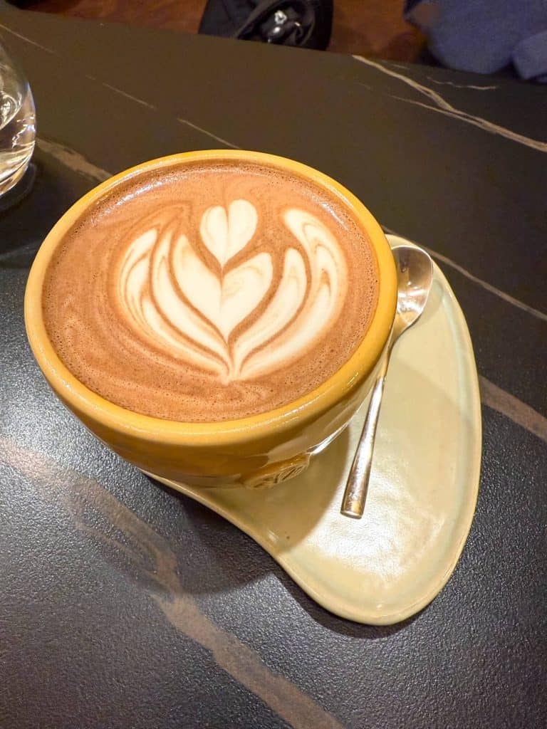A latte with latte art at a coffee shop in Miraflores, Lima.