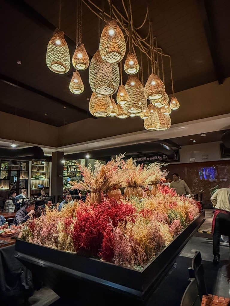 The upscale and beautiful center of floral piece and lights at Panchita, one of the best restaurants in Miraflores, Lima.
